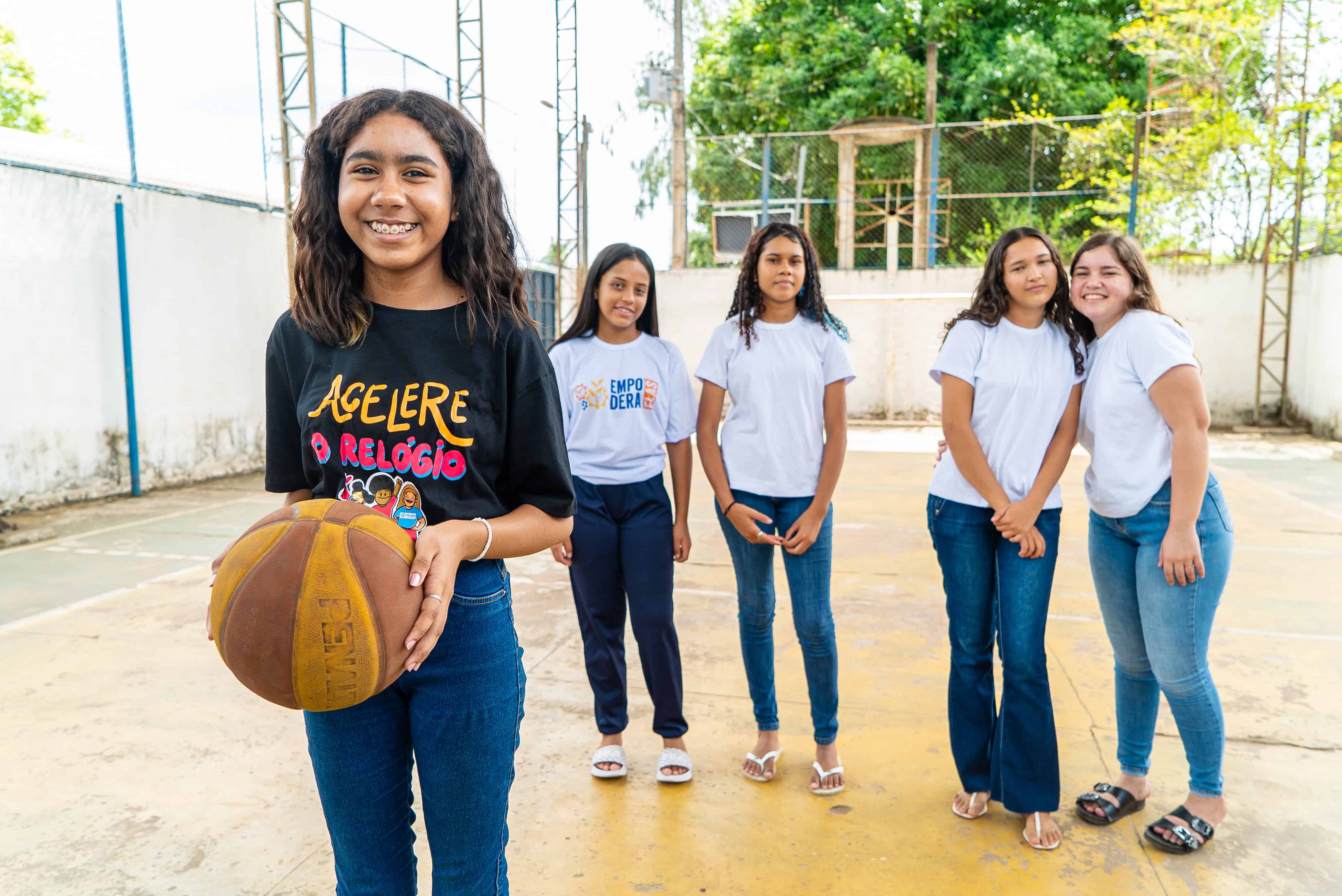Participants in Plan’s Leadership School for Girls gather on a basketball court in Brazil